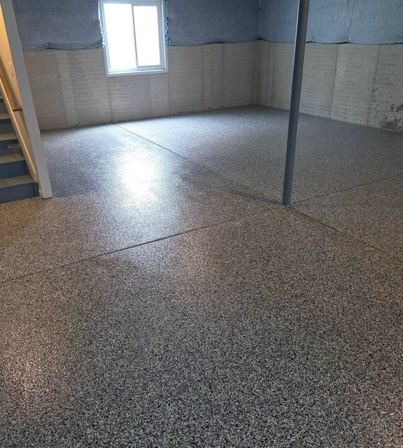Finished gray flake epoxy floor in a basement